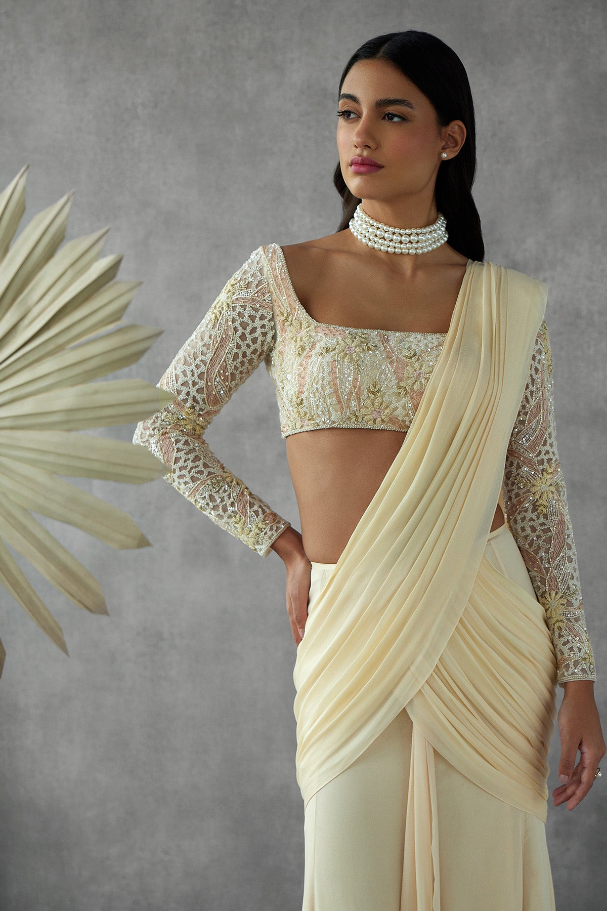 Cream Drape Saree Paired With Full Sleeve Embroidered Blouse