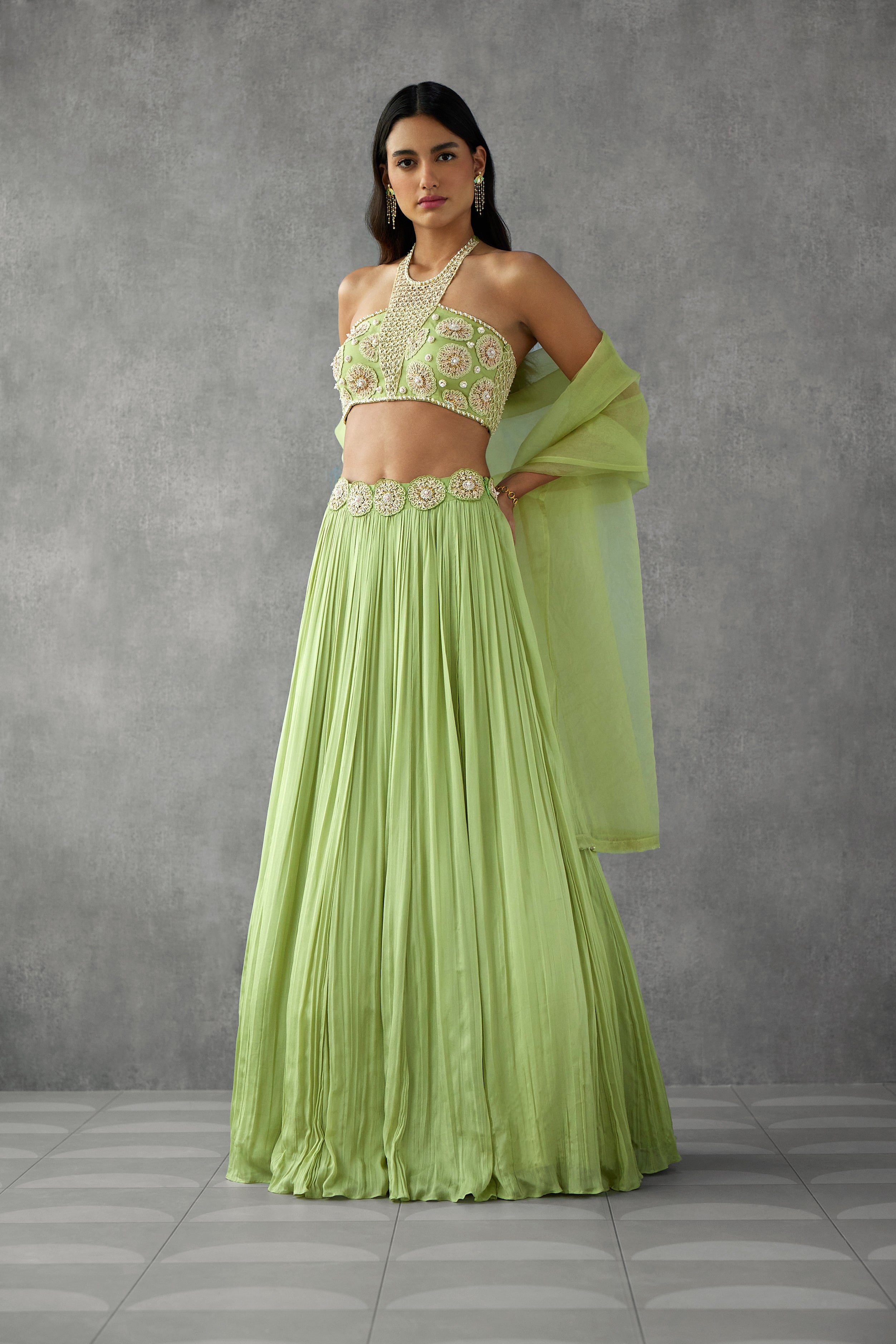Sage green lehenga set with delicate embroidery details