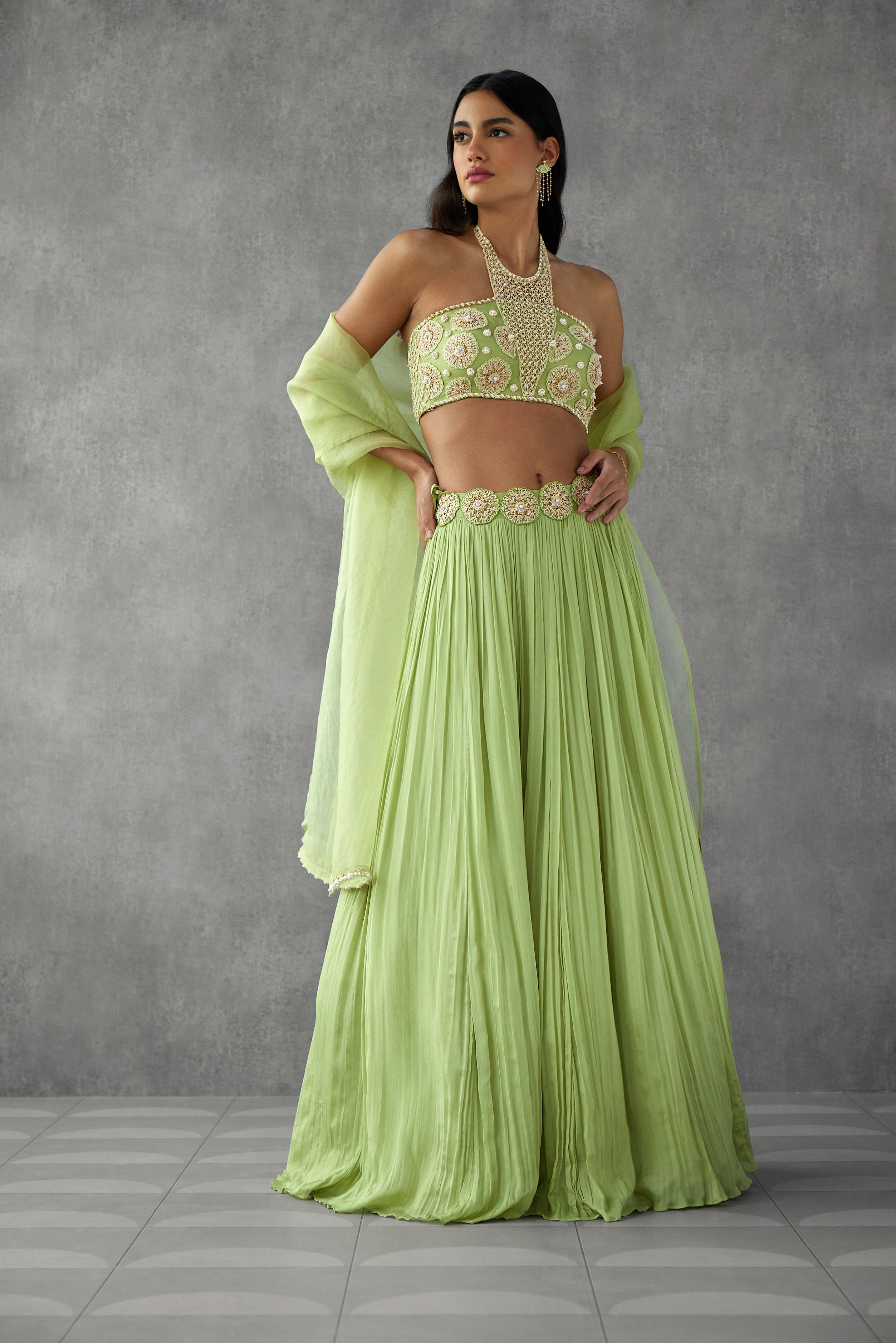Sage green lehenga set with delicate embroidery details