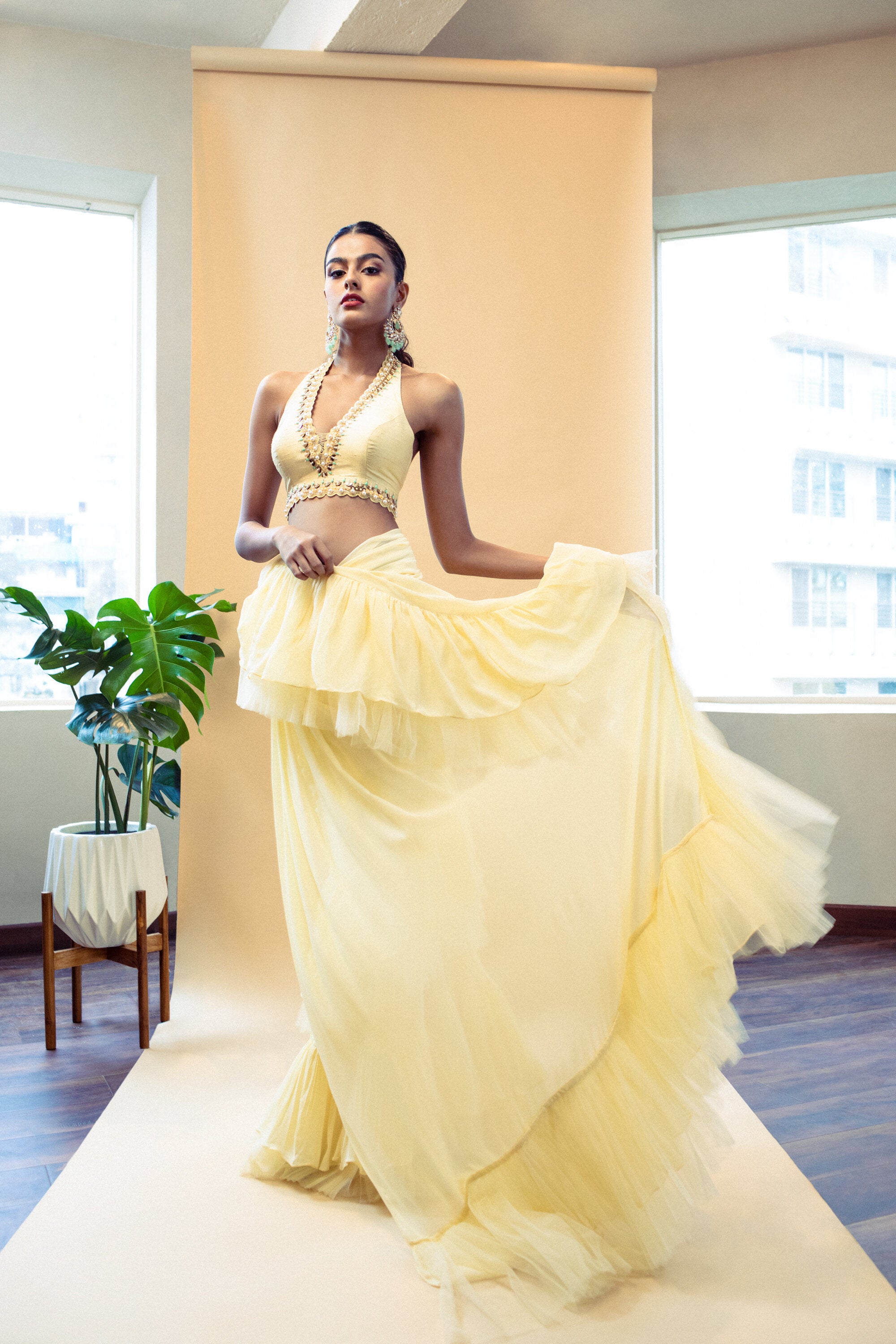 Yellow pre draped ruffle saree with embroidered blouse