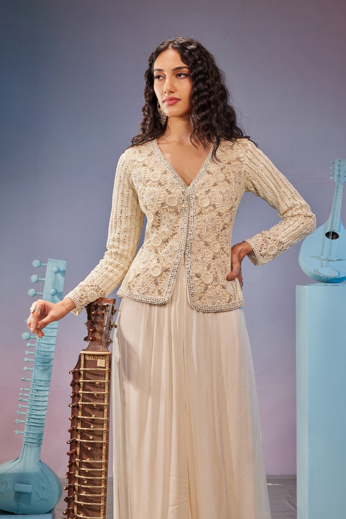 Hand embrodiered cut work jacket teamed with embroidered sharara pants