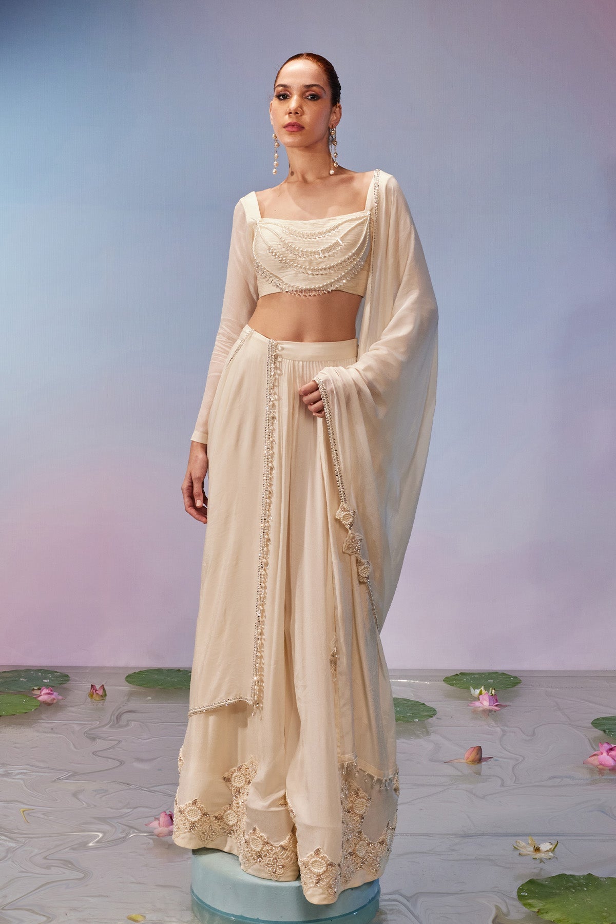 Full sleeve necklace style blouse teamed with embroidered sharara <b>Pant</b> & dupatta
