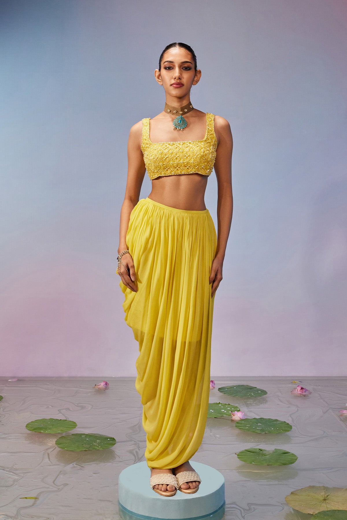 Cut- work blouse teamed with drape skirt